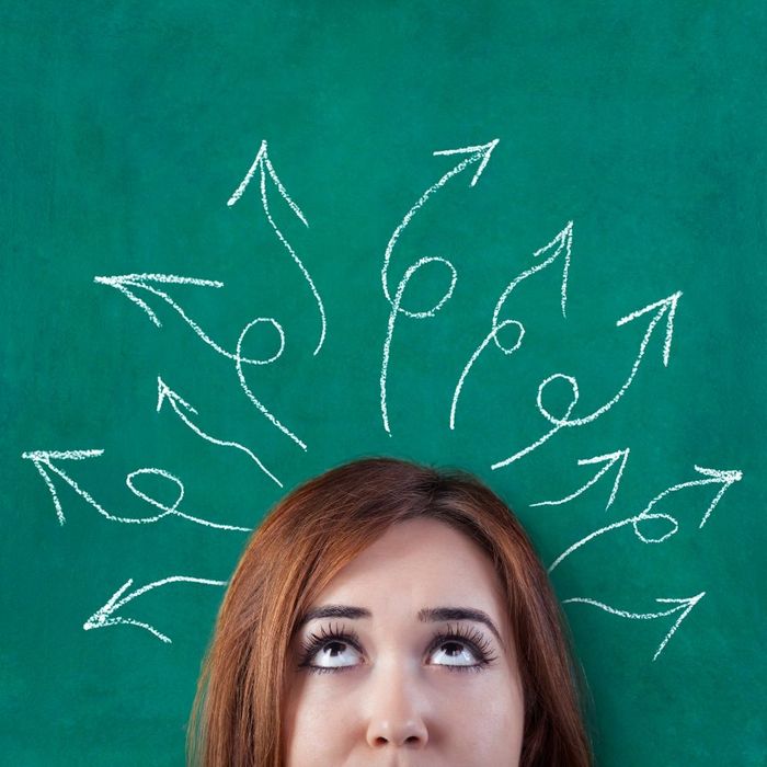 girl thinking with a green background